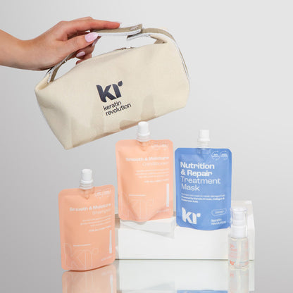 Keratin Revolution hair care products including a pouch, bottles, and masks on a light gray background.