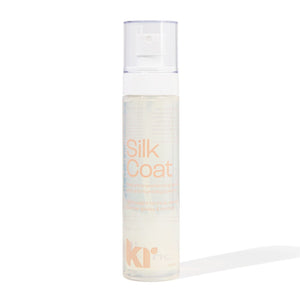 Bottle of Silk Coat hair product on a white background