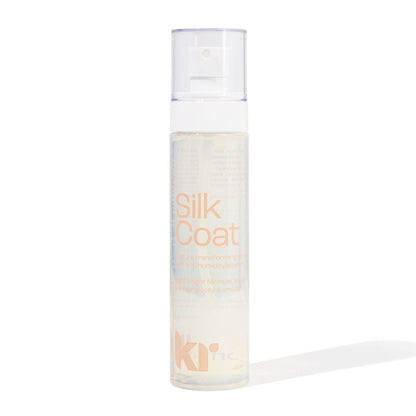 Bottle of Silk Coat hair product on a white background