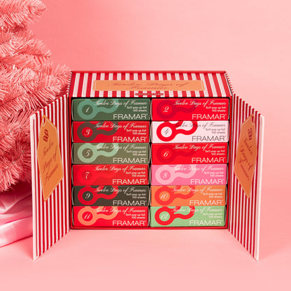 Set of Framar product boxes in a decorative box on a pink background