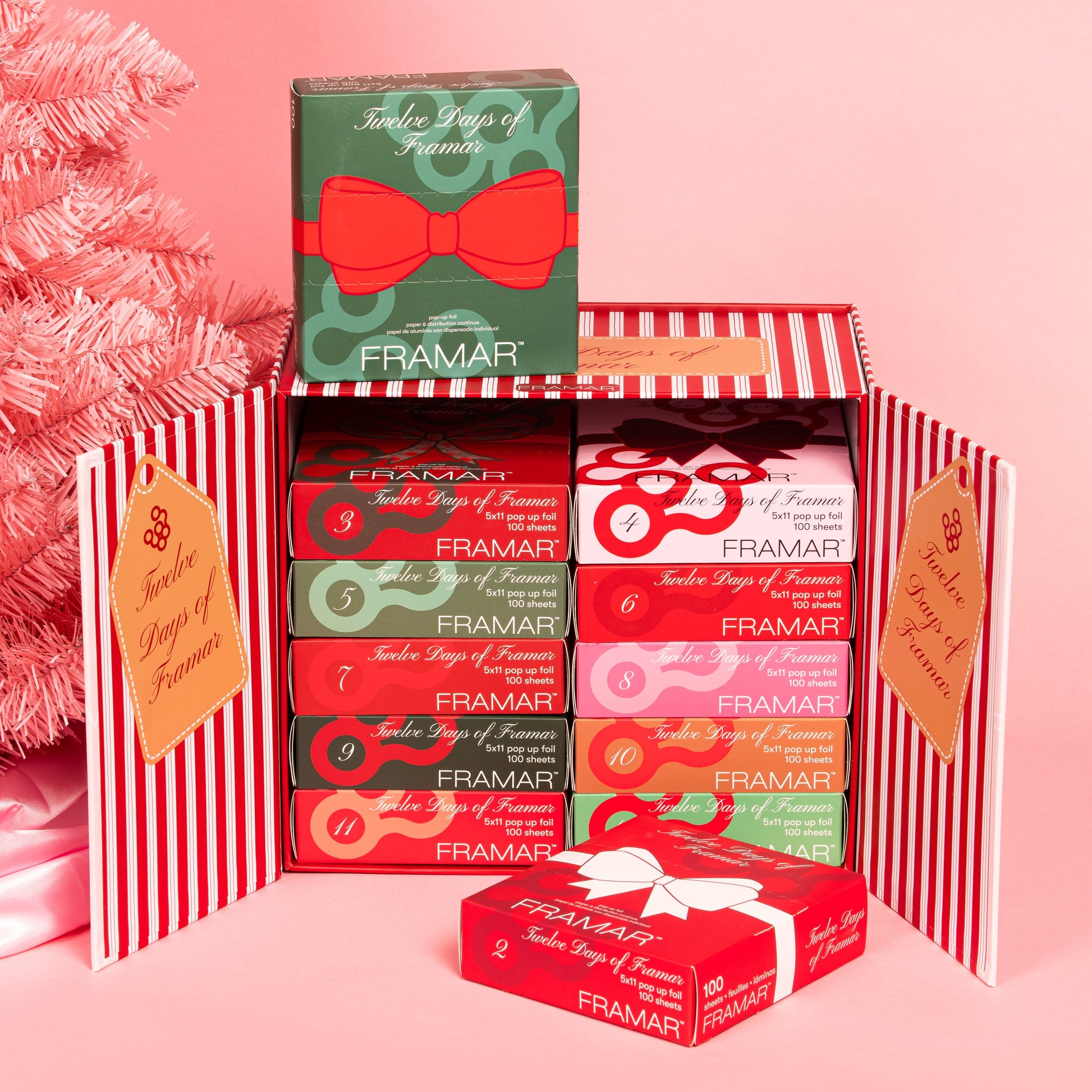 Framar candy boxes in a decorative box with a pink background